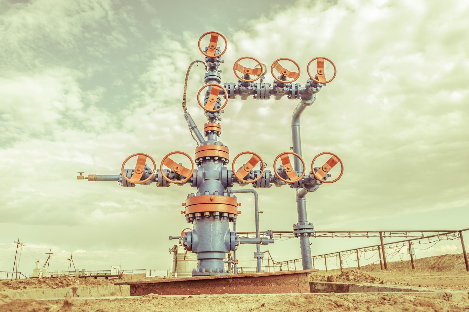 Wellheads with valve armature on a oil field.
